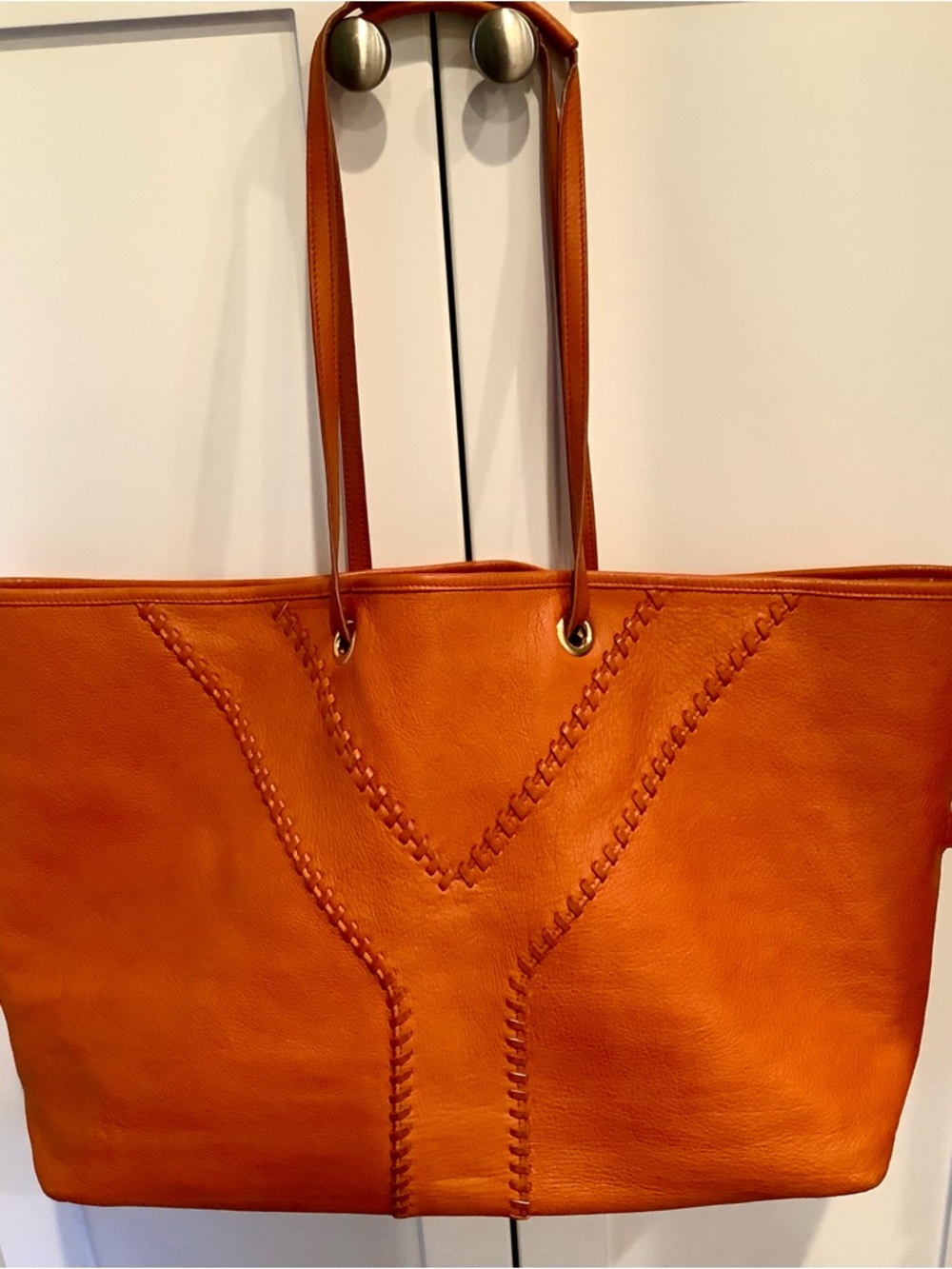 Yves Saint Laurent Orange Leather Tote with Whipstitch Y Motif. Reversible tote